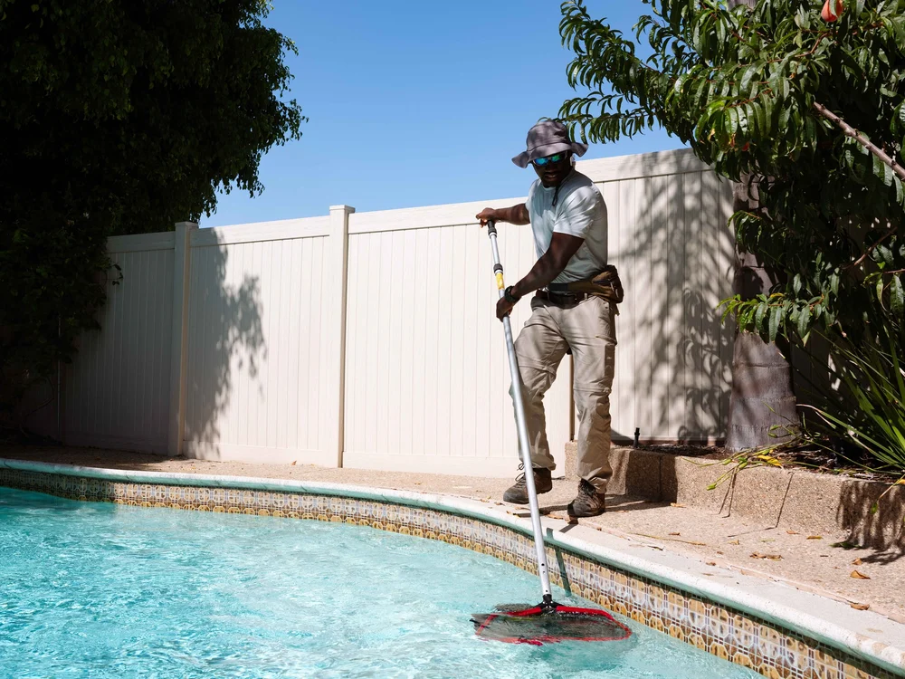 Jairod James servicing a pool